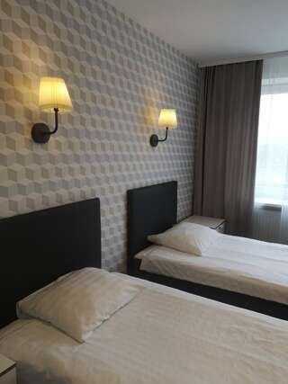 Отель Dzintarjura Вентспилс Улучшенный двухместный номер с 2 отдельными кроватями-1